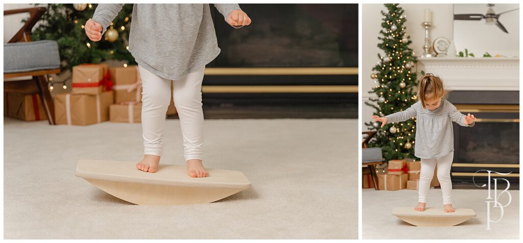 Girl playing balance board in Christmas