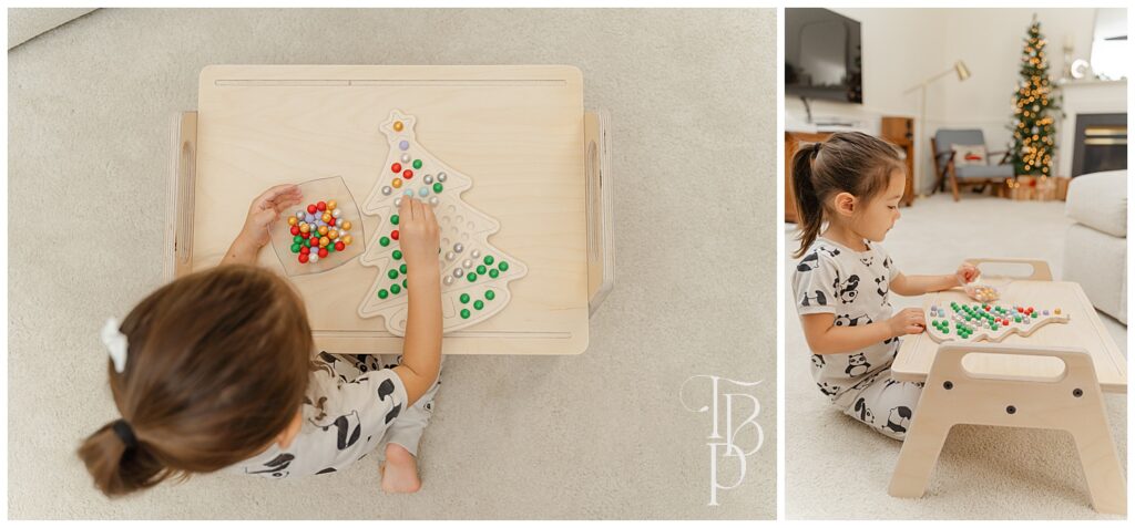 Girl playing with Christmas tree activity board during product pictures