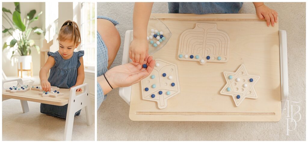 Girl playing with Hanukkah activity board