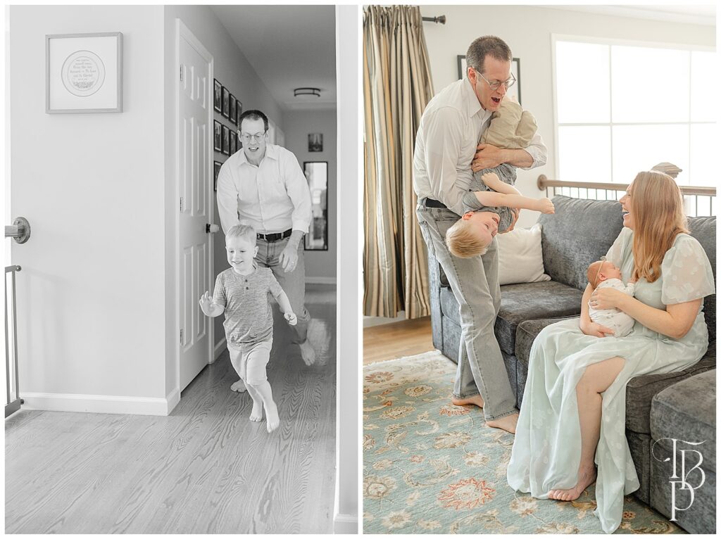 Big brother playing with parents at home with newborn baby sister
