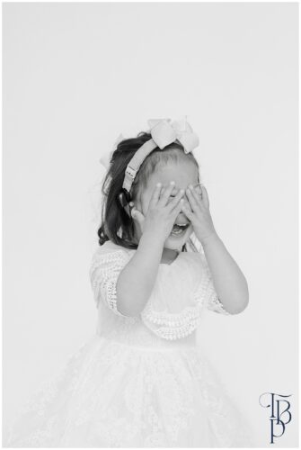 little girl hiding her face during Northern Virginia personality portraits