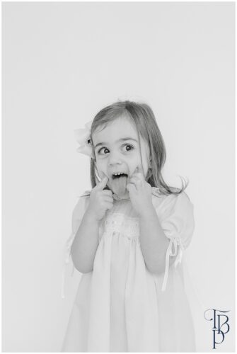 little girl with her tongue out