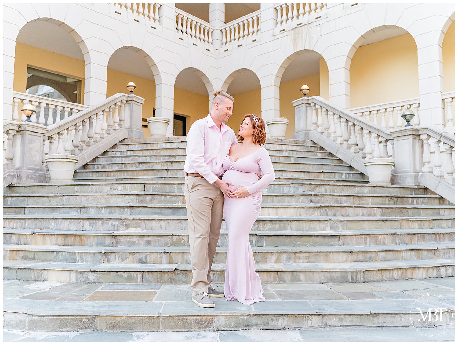 expecting couple by the staircase during maternity photography in Warrenton, Virginia