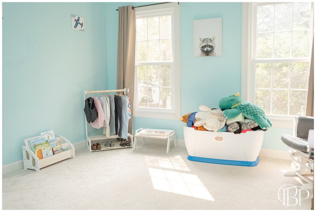 Boy’s bedroom styled with Montessori-inspired toys and wooden furniture