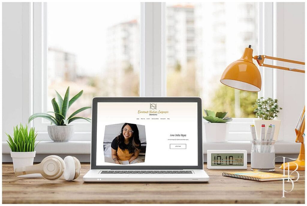 Laptop displaying a business website featuring professional brand photography